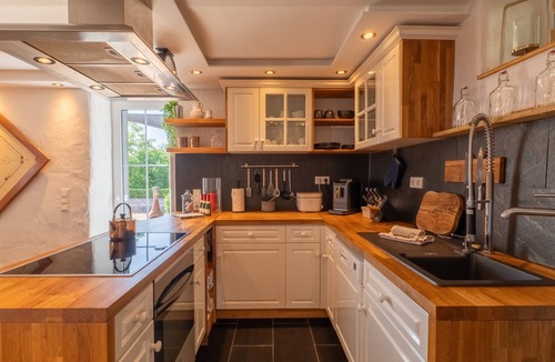 Feuerscheid House | Charming Eifel Bakehouse with Sauna, Private Terrace & EV Charging