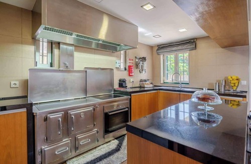 Paredes House | Classic Villa w/Gym & Pool Access by HostWise