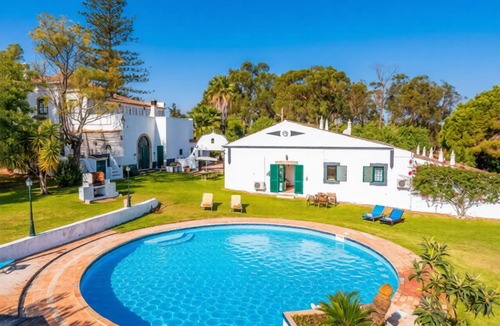 Moncarapacho e Fuseta Apartment | Enjoy relaxed Algarve living in Fuseta with a shared pool and garden views.