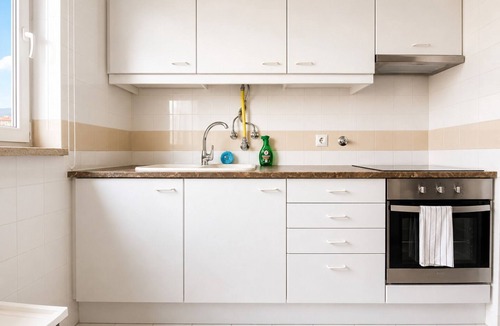 Carnide Apartment | Lisbon Luxury T1: Free Pool, Tennis, Gym, Game Room & Parking