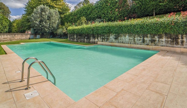 Exclusive flat, family-friendly with private pool, gardens and playground!