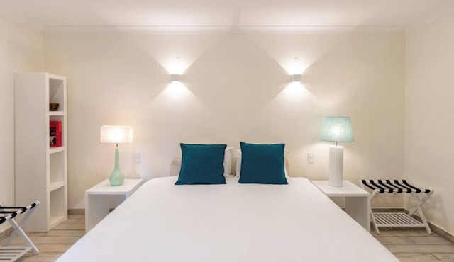 Experience Golden Bay Views from a Peaceful Suite Near Burgau Beach