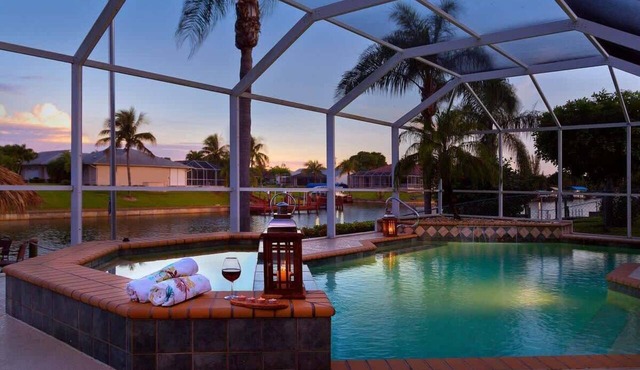 Pretty Waterfront Home w/Heated Pool/Spa + Tiki in Cape Coral
